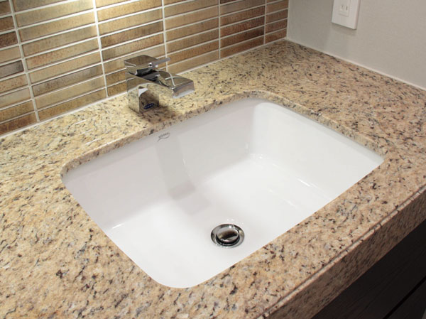Bathing-wash room.  [Wash bowl of natural stone counter] The counter top vanity, It has adopted a natural stone.