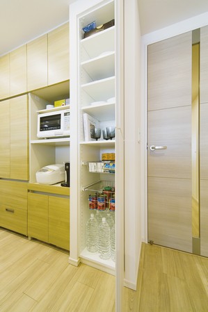 The kitchen has established a pantry that can store plenty, such as food and beverage stock up.
