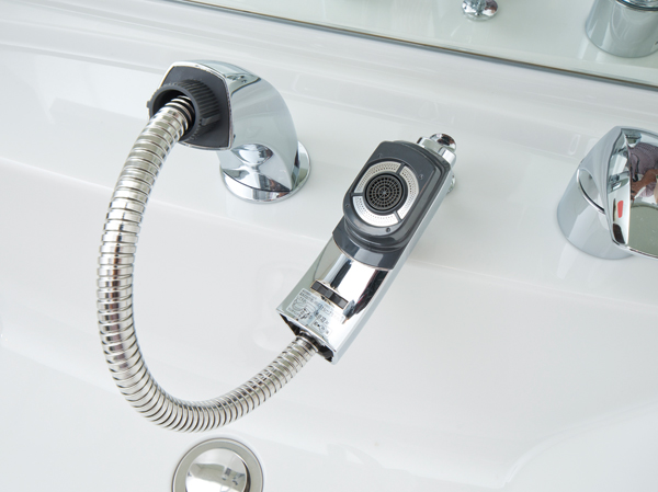 Bathing-wash room.  [Moveable type shower faucet] It is a movable type hose faucet part is extended. Switching of the water discharge can also be at the touch of a button.