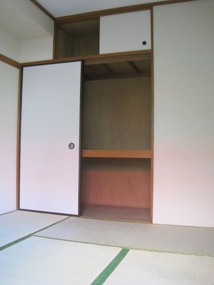 Living and room. Armoire ・ There are upper closet storage.