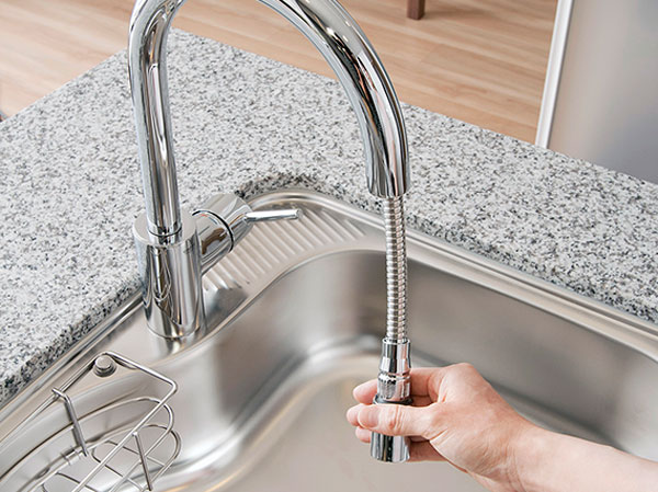Kitchen.  [Hand Shower Faucets] Adopt a hand shower faucet that can be drawn. This is useful, such as sink of care.