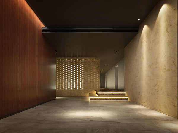 Shared facilities.  [Entrance lobby of the approach to the quiet everyday] Arrange different material of the texture on the left and right sides of the wall, Creating an asymmetry space beauty. By the effect of the light skillfully using the indirect lighting, It will produce the atmosphere of warmth in the intellectual. (Entrance lobby Rendering)