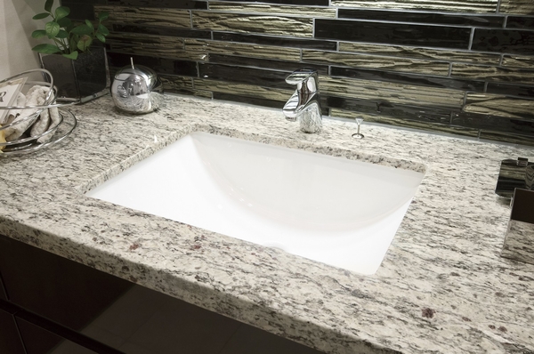 Basin counter tops of natural stone strike a sense of luxury. High even design mosaic tile, It is a sophisticated atmosphere