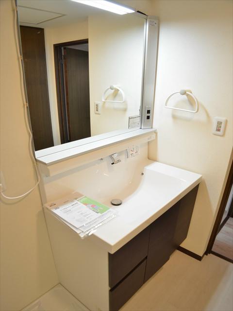 Wash basin, toilet. Dressing in a wash basin of the three-sided mirror