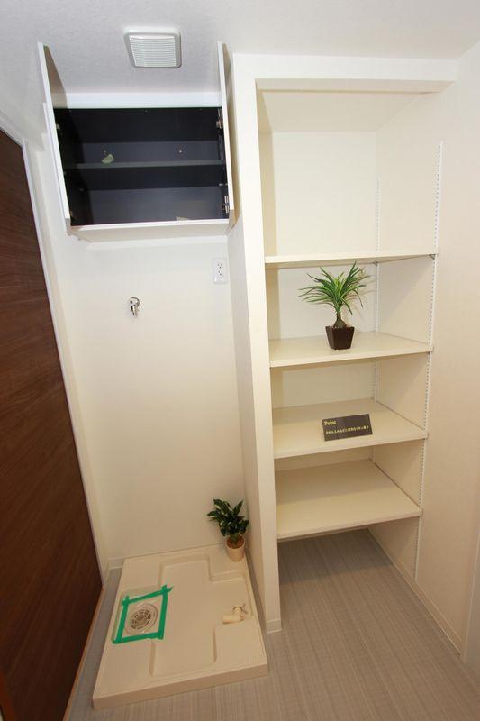 Wash basin, toilet. Washing machine Storage