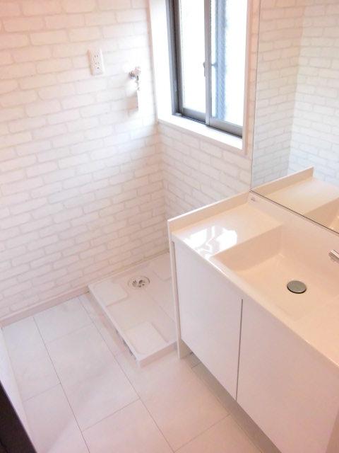 Wash basin, toilet. It is the washroom