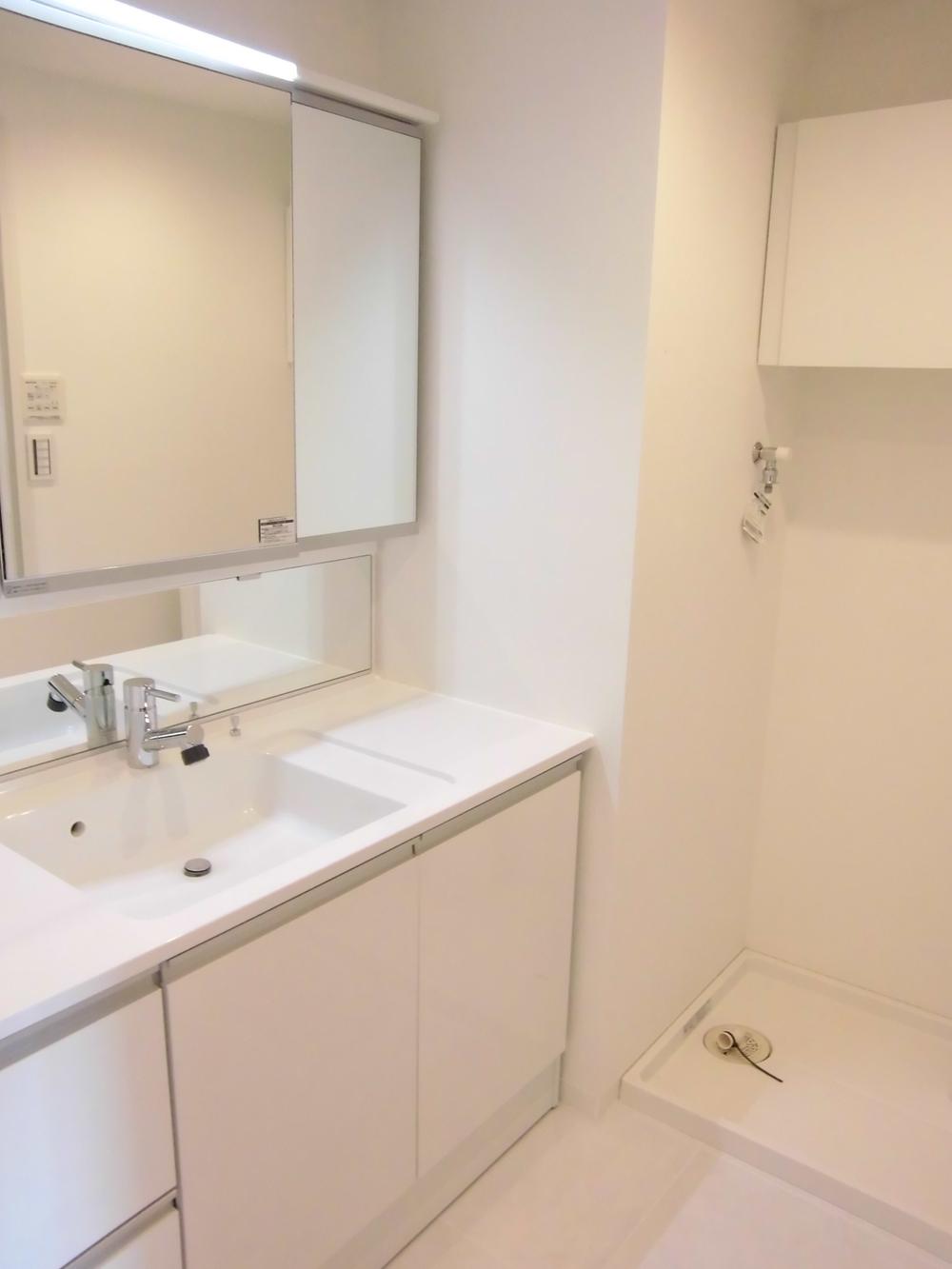 Wash basin, toilet. It is the washroom