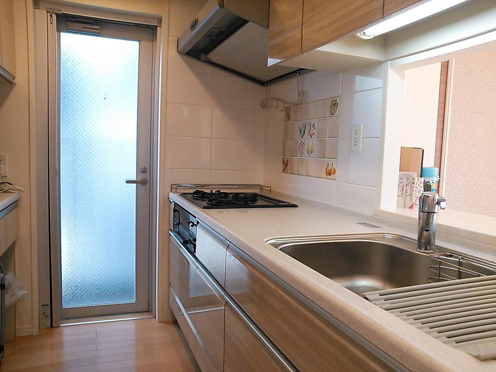 Kitchen. You go out on the balcony from the kitchen!  Gas stove of the wall is stuck stylish tile