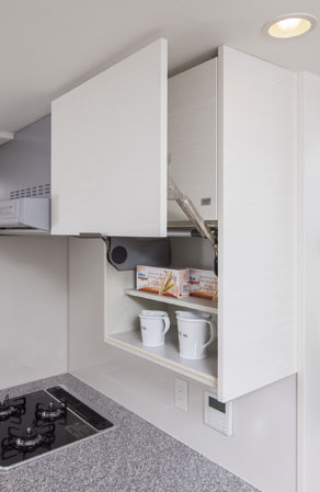 Kitchen.  [System Wall storage] And a hanging cupboard of hard-to-reach high altitude in a conventional half the company, Extend the opening of the kitchen. Even during the cooking, The bottom of the hanging cupboard is put to remain open in the flap-up door. (Except B type)