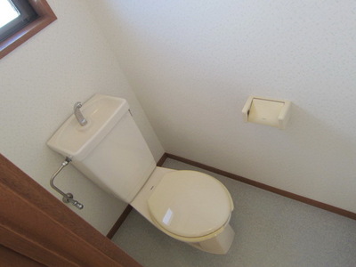 Toilet. It is a small window with a toilet