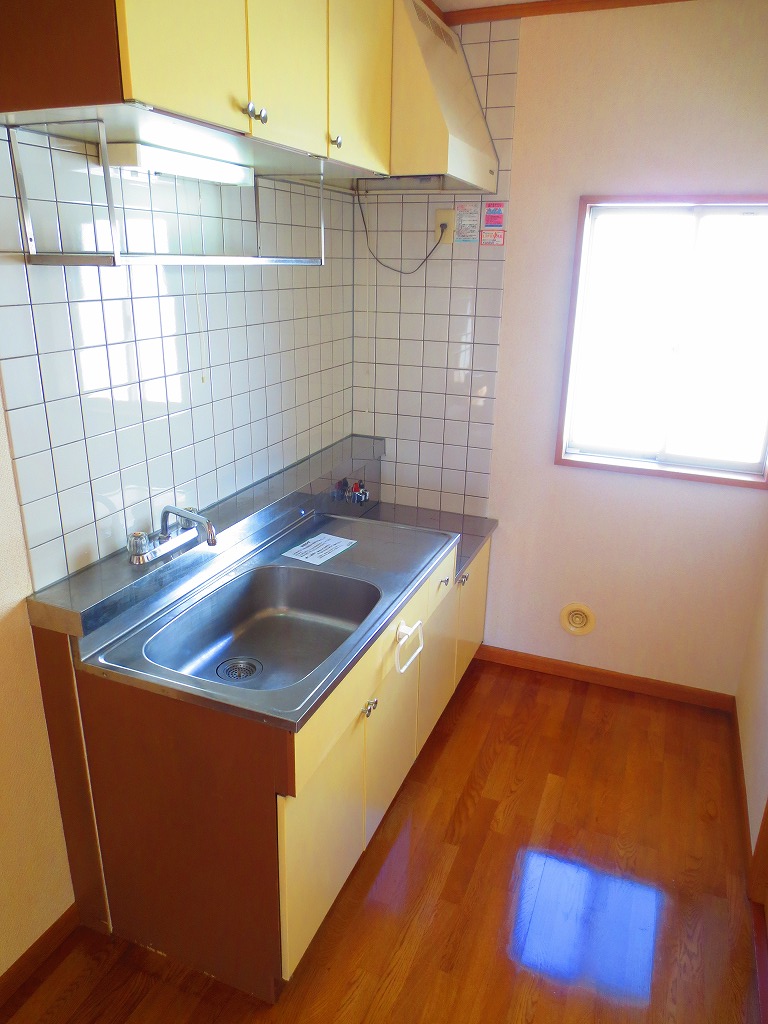 Kitchen. It is around the bright kitchen there is a window