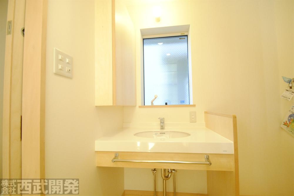 Wash basin, toilet. Bathroom vanity