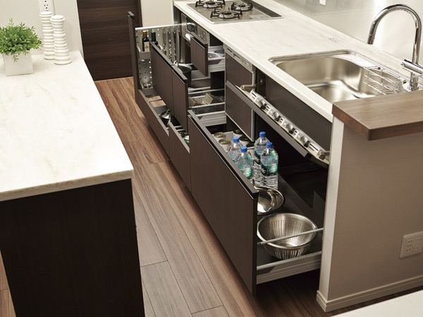 Kitchen.  [Slide storage] At the bottom of the kitchen counter, Adopt the easy access easy to put away sliding storage. It is software with close function to close quietly.