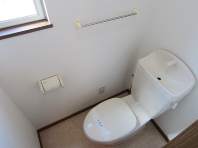 Toilet. It is a small window with a toilet