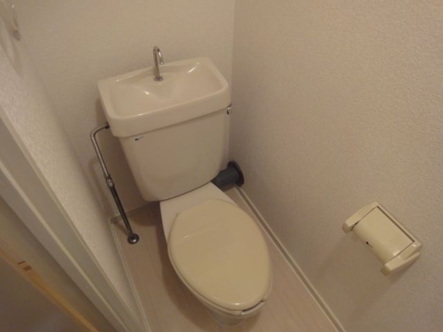 Toilet. There is space put a cutting board.