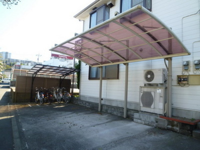 Parking lot. Covered parking and bicycle parking