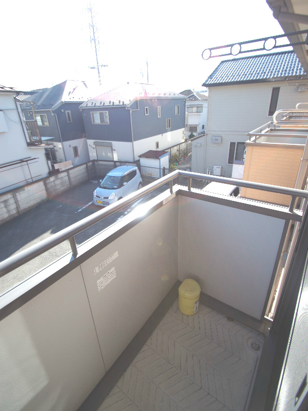 Balcony. Same building, It is a photograph of the same floor plan of the room. 