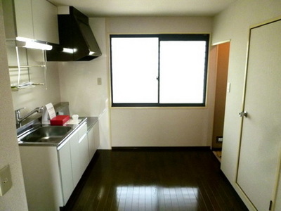 Living and room. There is a window in the kitchen