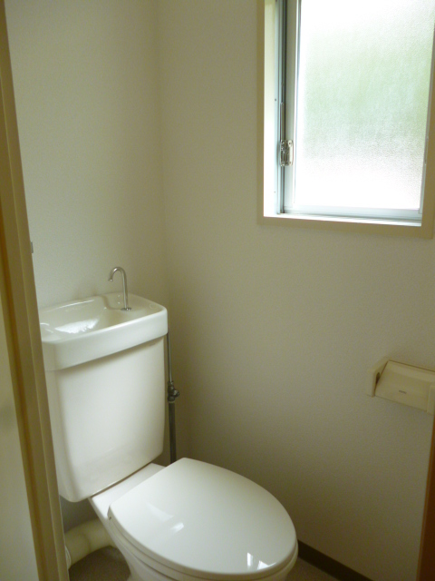 Toilet. Toilet with two. & Room of toilet with a window