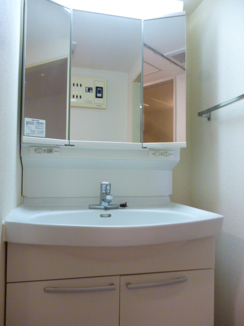 Washroom. Vanity with a three-sided mirror