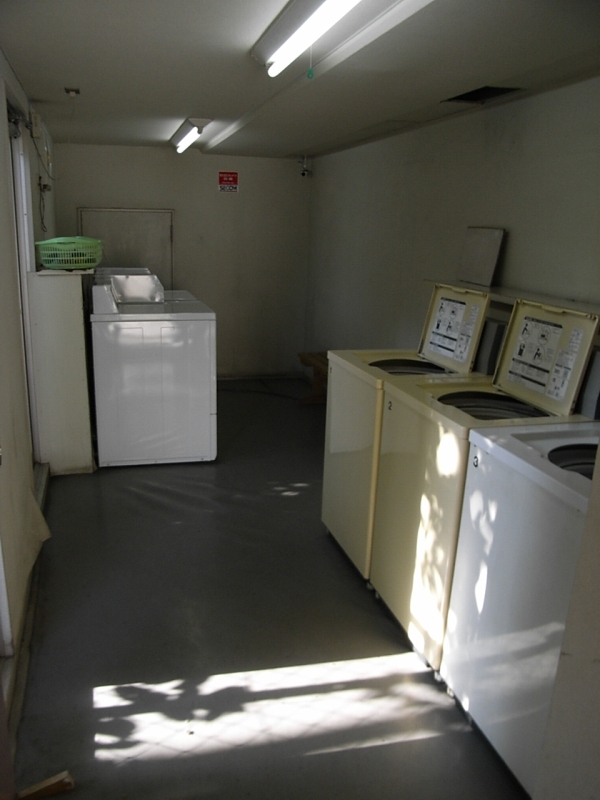 Other common areas. Coin-operated laundry machines installed in the building
