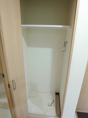 Other Equipment. Door with a washing machine Storage