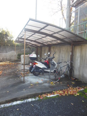 Other common areas. Probably still bicycle parking lot with a roof, Bicycle parking is