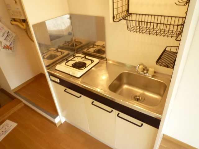 Kitchen. It comes with up to a shelf with a mouthful gas stove.