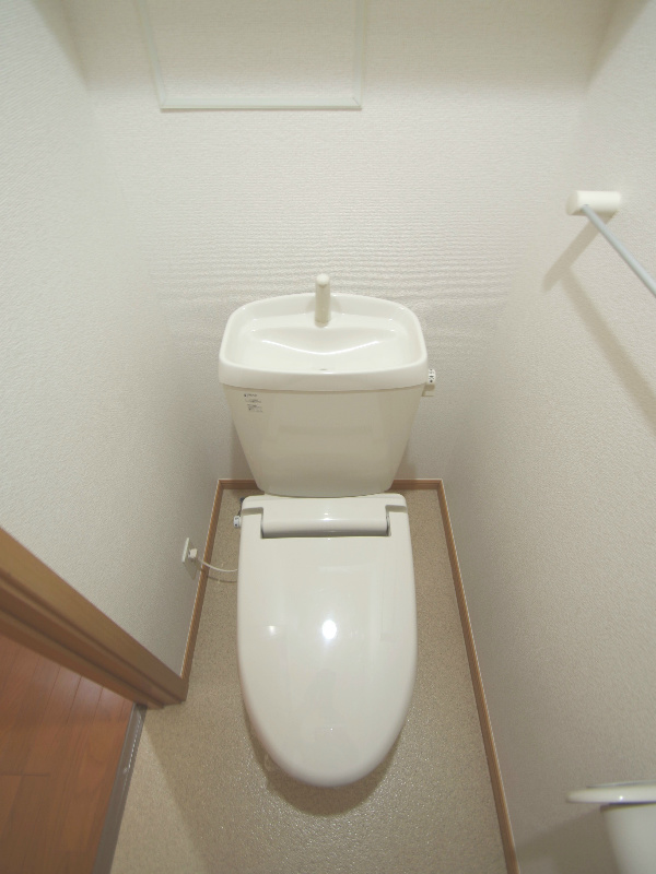 Toilet. A heated toilet seat