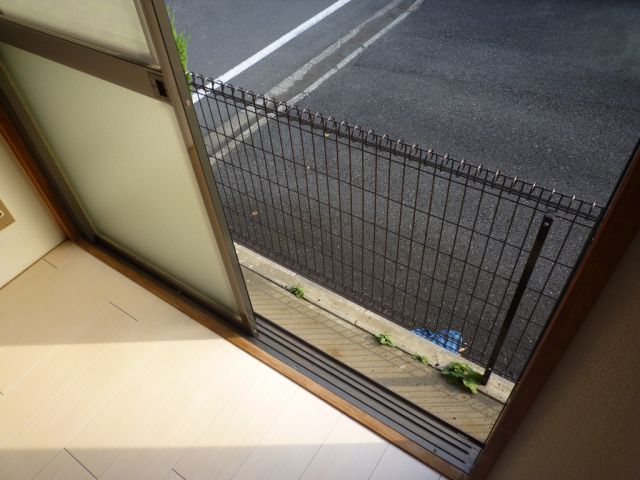 Balcony. The first floor but has been separated from the road surface by the sash. 