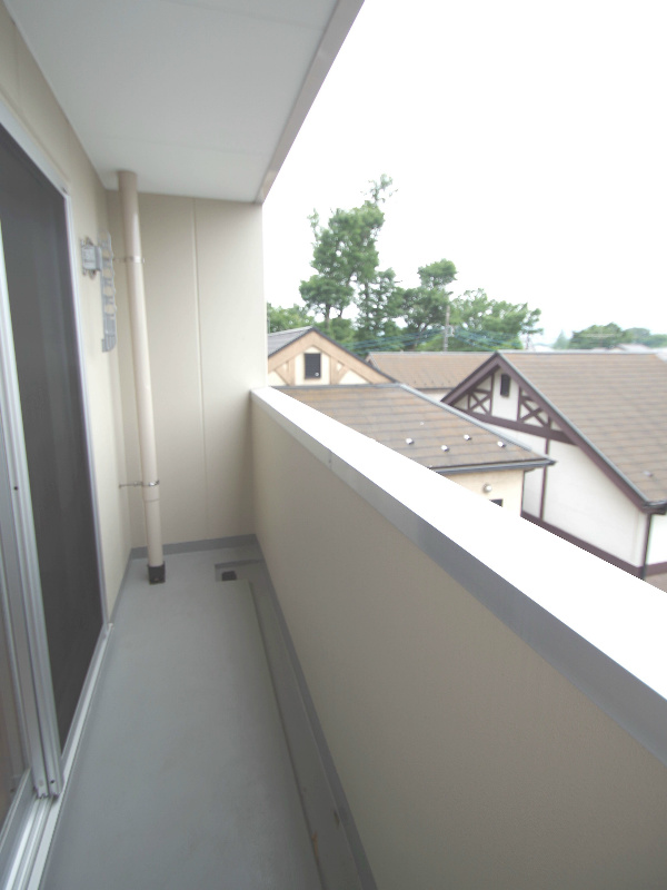 Balcony. It is a photograph of Room No. of different same building. (image)