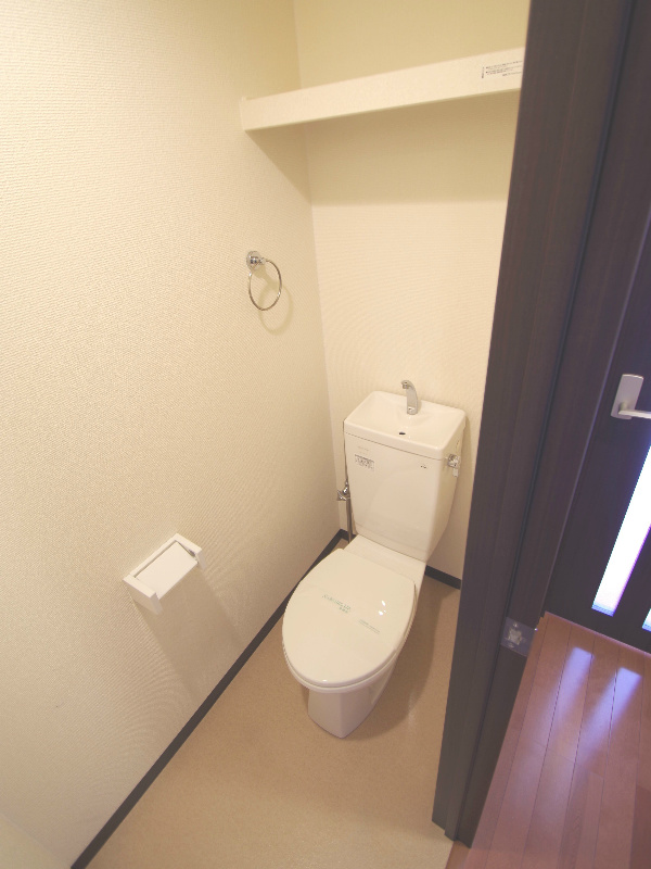 Toilet. It is a photograph of Room No. of different same building. (image)