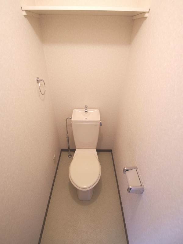 Toilet. It will be in the photo of the other room number of the same building. (image)