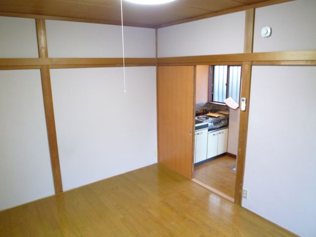 Living and room. There is a partition of the kitchen and the room