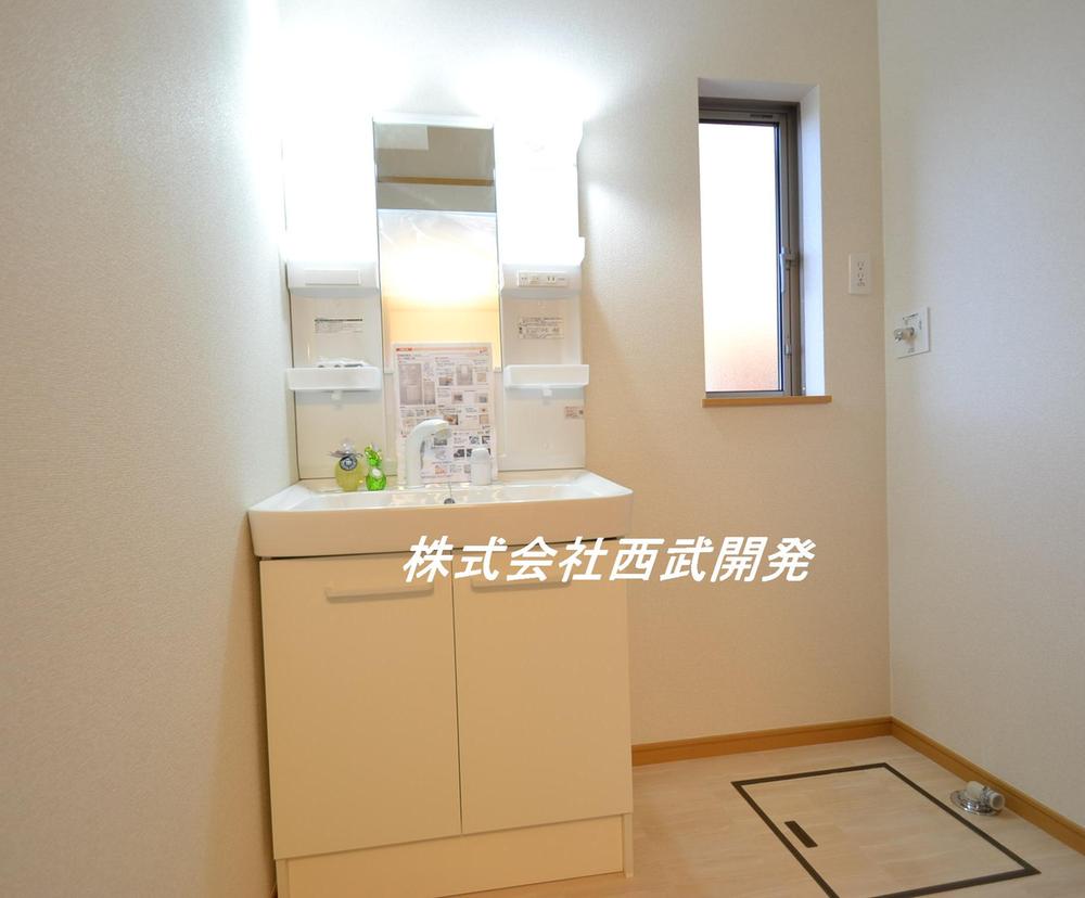 Wash basin, toilet. E Building