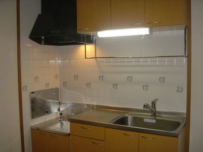 Kitchen. Abundant storage in with hanging cupboard