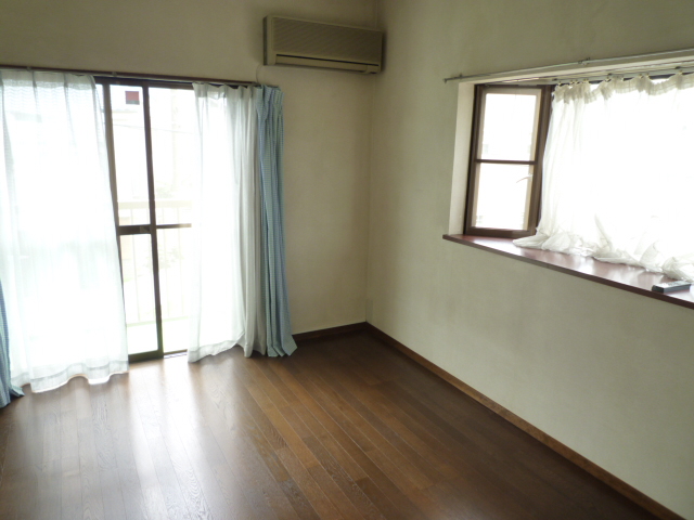 Living and room. There is a bright and airy because the window there are two sides