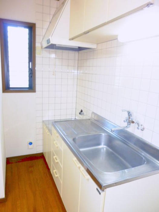 Kitchen. There is a window in the kitchen next to