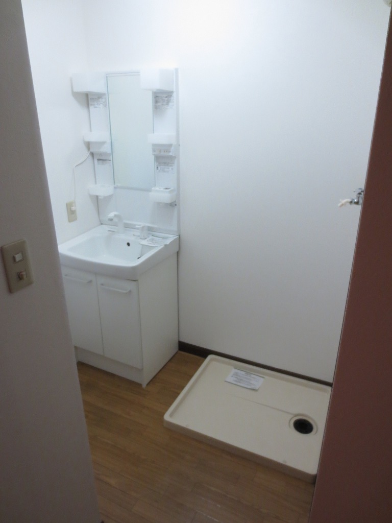 Washroom. There is also a waterproof pan with Washing machine in the room