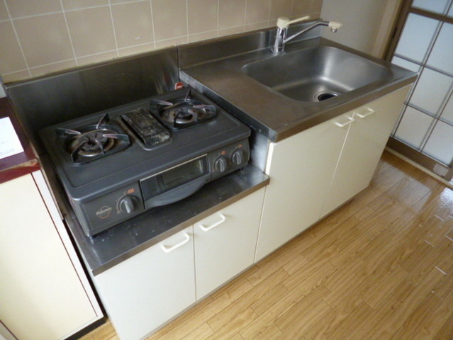 Kitchen. Two-burner gas stove is it installed base of