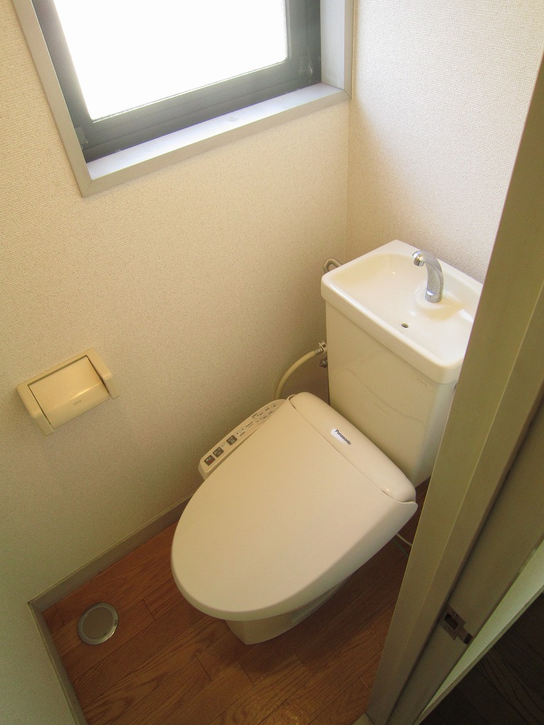 Toilet. It is bright and there is a window