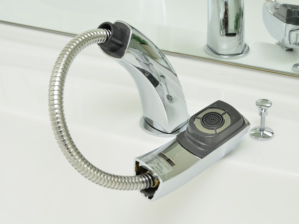 Bathing-wash room.  [Lift-up shower faucet] Adoption of a single-lever mixing shower faucet. Since the faucet hose is extensible it is useful for cleaning of shampoo and bowl.