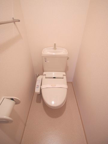 Toilet. Will be inverted type of photos of the same building (image)