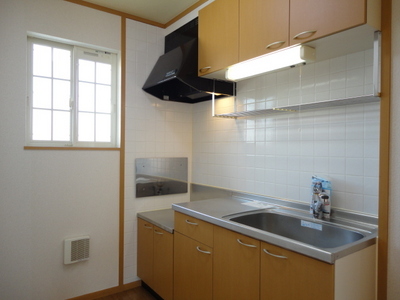 Kitchen. Storage-rich kitchen with hanging cupboard