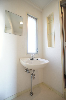 Washroom. There is also a window, Bright washbasin