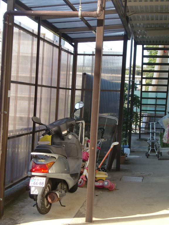 Parking lot. Entrance side Covered Chuwasho. 