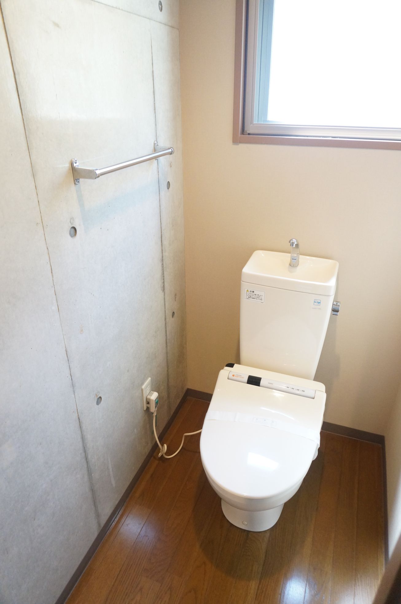 Toilet. There is a small window, With Washlet