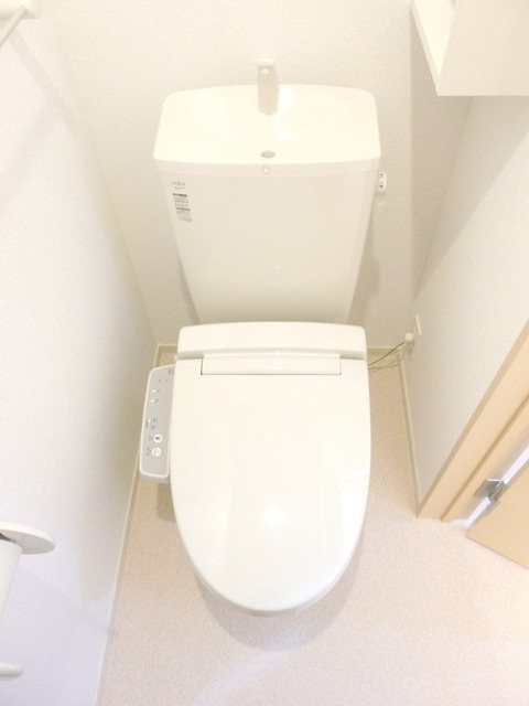 Toilet. Toilet is equipped with Washlet