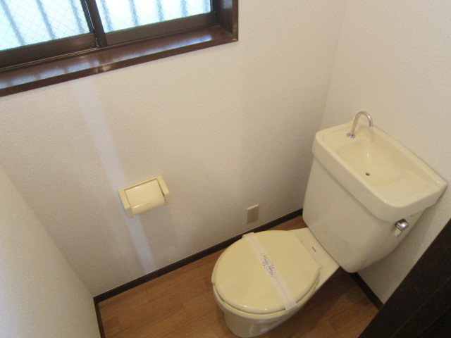 Toilet. It is a window with a toilet