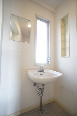 Washroom. There is also a window, Bright washbasin